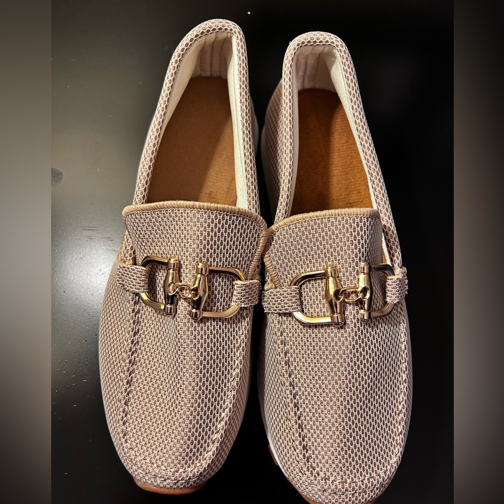 Size 9 Brand new slip on very comfortable shoes.  ( fit similar to Hey Dudes)